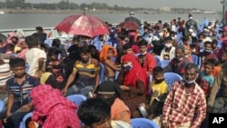 Rohingya refugees are transported on a naval vessel to Bhasan Char, or floating island, in the Bay of Bengal, from Chittagong, Bangladesh, Friday, Dec. 4, 2020. (AP Photo)