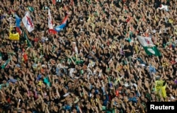 FILE - Demonstrators attend a rally in protest of election result at a stadium in Kelana Jaya, outside Kuala Lumpur, May 8, 2013.