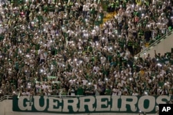 Supporters of Brazil's Chapecoense soccer team gather for a memorial to remember the players who died in a plane crash in Colombia, at Arena Condado stadium in Chapeco, Brazil, Nov. 30, 2016.