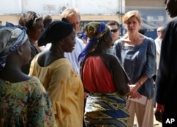 U.S. Ambassador to the United Nations Samantha Power speaks to IDP women at the makeshift camp where over 40,000 found refuge at the airport in Bangui, Central African Republic, Dec. 19, 2013.