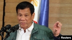 FILE - Philippine President Rodrigo Duterte speaks during a news conference in Davao.