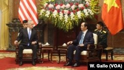 U.S. Defense Secretary Jim Mattis chats with Vietnamese President Tran Dai Quang at the presidential palace in Hanoi, Vietnam, Jan. 25, 2018.