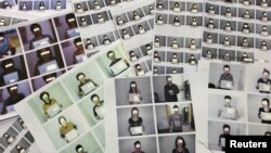 Photo sheets of the North Korean refugees helped by the North Korea Refugees Human Rights Association of Korea are displayed in Seoul, South Korea, June 11, 2019. Picture taken June 11, 2019. (REUTERS/Josh Smith)