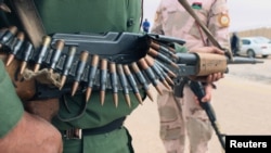 FILE - Forces, which are allied to the U.N.-backed government in Tripoli, deploy in Sirte, Libya, March 12, 2019.