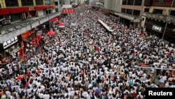 Demonstrators attend a protest to demand authorities scrap a proposed extradition bill with China, in Hong Kong, China June 9, 2019. (REUTERS/Tyrone Siu)