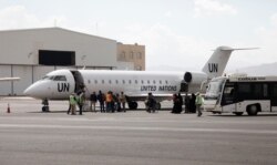 Yemenis board a United Nation plane at Sana'a International airport, Yemen, Feb. 3, 2020. The United Nations medical relief flight carrying patients from Yemen's rebel-held capital was the first in over three years.