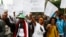 FILE - People protest against an earlier security force attack on a student rally in Oromo during a demonstration organized by the opposition Ethiopian Federal Democratic Unity Forum, in Addis Ababa, May 2014. 