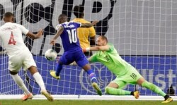 Haiti midfielder Wilde-Donald Guerrier (10) scores the winning goal past Canada goalkeeper Milan Borjan (18) as defender Derek Cornelius (4) looks on during the second half of a CONCACAF Gold Cup soccer quarterfinal Saturday, June 29, 2019, in…
