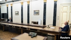 Russian Foreign Minister Sergei Lavrov attends a meeting with Russian President Vladimir Putin in Moscow