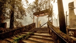 FILE - In this Sept. 28, 2020, file photo, a staircase remains at the Restaurant at Meadowood, which burned in the Glass Fire, in St. Helena, Calif. (AP Photo/Noah Berger, File