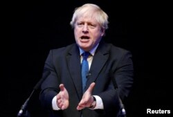 FILE - Boris Johnson speaks at the Conservative Party Conference in Birmingham, England, Oct. 2, 2018.