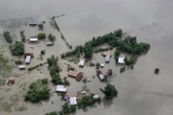 An aerial view of flooded Majuli, an island in River Brahmaputra, Assam, India, Tuesday, July 16, 2019.