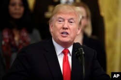 President Donald Trump speaks about crude pipe bombs targeting Hillary Clinton, former President Barack Obama, CNN and others, in the East Room of the White House, Oct. 24, 2018, in Washington.