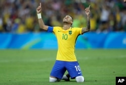 Brazil's Neymar cries as he celebrates after scoring the decisive penalty kick during the final match of the men's Olympic football tournament between Brazil and Germany at the Maracana stadium in Rio de Janeiro, Aug. 20, 2016.