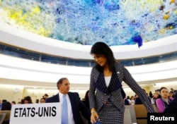 FILE - U.S. Ambassador to the United Nations Nikki Haley (R) leaves after addressing the United Nations Human Rights Council in Geneva, Switzerland, June 6, 2017.