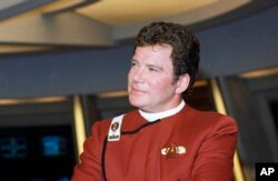 FILE - In this 1988 photo, William Shatner poses as Captain James T. Kirk while promoting the movie "Star Trek V: The Final Frontier."