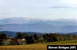 The Great Smoky Mountains rise in the background.