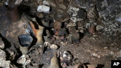Pre-columbian artifacts sit in a cave at the Mayan ruins of Chichen Itza, Yucatan, Mexico, Tuesday, Feb. 19, 2019. (Karla Ortega/Mexico's National Institute of Anthropology and History via AP)