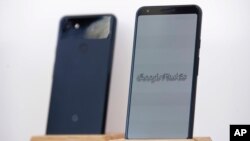 Google Pixel 3a phones are displayed at the Google I/O conference in Mountain View, Calif., Tuesday, May 7, 2019. (AP Photo/Jeff Chiu)