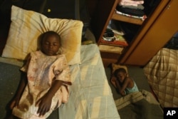 FILE - Children take an afternoon nap at an orphanage in Harare, Zimbabwe, May 26, 2006. One of the biggest problems caused by AIDS in Africa is the number of children who are being orphaned as the disease kills their parents and guardians.