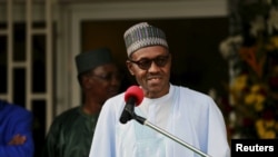 FILE - Nigerian President Muhammadu Buhari speaks during a news conference.