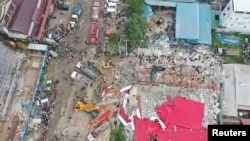 An overhead view of a collapsed under-construction building in Sihanoukville, Cambodia, June 22, 2019.