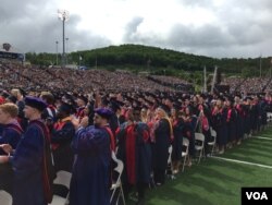 Liberty University students cheer after hearing "Land of the Free and Home of the Brave" at the Christian school's commencement ceremony in Lynchburg, Virginia, May 13, 2017. (C. Presutti/VOA)