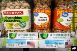 FILE - Imported nuts from the United States are displayed at a supermarket in Beijing, March 23, 2018.