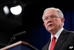 FILE - Attorney General Jeff Sessions speaks during a news conference at the Department of Justice in Washington, Nov. 1, 2018.