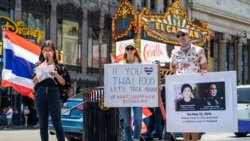 Members of the Thai Rights Now movement hold placards during the 7th anniversary of Thailand's coup rally at Hollywood Walk of Fame, Los Angeles, CA. May 22, 2021