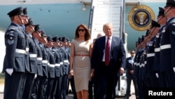 President Donald Trump and first lady Melania Trump arrive at Stansted Airport, Britain, July 12 2018.