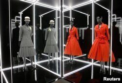 Creations on display during a photocall for the "Christian Dior: Designer of Dreams" exhibition at the Victoria & Albert (V&A) Museum in London, Jan. 30, 2019.