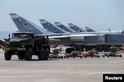 Russian military jets are seen at Hmeymim air base in Syria, June 18, 2016.