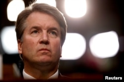 FILE - U.S. Supreme Court nominee Brett Kavanaugh listens during his Senate Judiciary Committee confirmation hearing on Capitol Hill in Washington, U.S., Sept. 4, 2018.