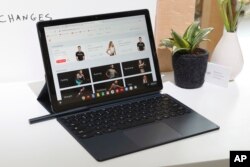 The Google Pixel Slate, with keyboard and stylus, is displayed in New York, Tuesday, Oct. 9, 2018. (AP Photo/Richard Drew)
