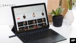 The Google Pixel Slate, with keyboard and stylus, is displayed in New York, Tuesday, Oct. 9, 2018. (AP Photo/Richard Drew)