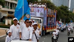 Supporters of Cambodian Prime Minister Hun Sen's People's Party start a campaign in Phnom Penh, Cambodia, Saturday, July 7, 2018.