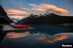Canoes are seen on a dock on Lake Louise at Banff National Park, in the Canadian Rocky Mountains.