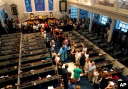 The Reverend Sidney Davis leads a group in prayer during a community prayer service at the Second Presbyterian Church near the Emanuel AME Church in Charleston, S.C., June 18, 2015.