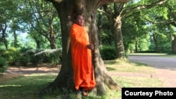 Luon Sovath relaxes under a tree in Leeds. (Chris Kelly)