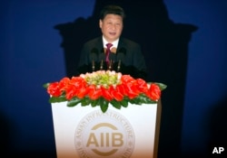 FILE: Chinese President Xi Jinping speaks during the opening ceremony of the Asian Infrastructure Investment Bank (AIIB) in Beijing Saturday, Jan. 16, 2016. (AP Photo/Mark Schiefelbein, Pool)