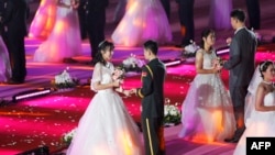 2018年5月20日，中國遼寧省瀋陽的東北大學舉辦集體婚禮。