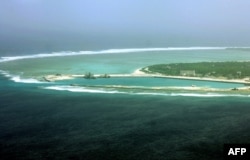 FILE - Part of the city of Sansha on the island of Yongxing, also known as Woody island in the disputed Paracel chain, which China now considers part of Hainan province.