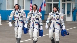 In this handout photo released by Roscosmos Space Agency Press Service U.S. astronaut Chris Cassidy, left, Russian cosmonauts Anatoly Ivanishin, centre, and Ivan Vagner, members of the main crew of the expedition to the International Space Station (ISS), walk prior the launch of Soyuz MS-16 space ship at the Russian leased Baikonur cosmodrome, Kazakhstan, Thursday, April 9, 2020. (Roscosmos Space Agency Press Service via AP)