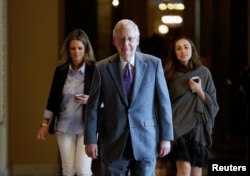 Senate Majority Leader Mitch McConnell (R-KY) walks to the Senate floor before a series of votes on immigration reform on Capitol Hill in Washington, U.S., Feb. 15, 2018.