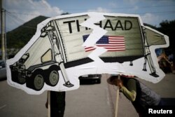 FILE - Protesters attend an anti-THAAD proest in Seongju, South Korea.