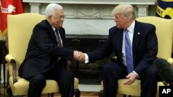 FILE - President Donald Trump shakes hands with with Palestinian leader Mahmoud Abbas during their meeting in the Oval Office of the White House, May 3, 2017, in Washington.