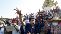Demonstrators flash a three-fingered symbol of resistance against the military coup and shout slogans calling for the release of detained Myanmar leader Aung San Suu Kyi during a protest in Mandalay, Myanmar on Feb. 10, 2021.