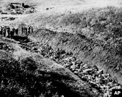 FILE - This a 1944 file photo of part of the Babi Yar ravine at the outskirts of Kiev, Ukraine where the advancing Red Army unearthed the bodies of 14,000 civilians killed by fleeing Nazis, 1944. Ukrainians have marked the 75th anniversary of the Babi Yar massacre, one of the most infamous mass slaughters of World War II. (AP Photo, file)