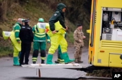 Military forces work on a van in Winterslow, England, March 12, 2018, as investigations continue into the nerve-agent poisoning of Russian ex-spy Sergei Skripal and his daughter, Yulia, in Salisbury, England, on March 4,2018.